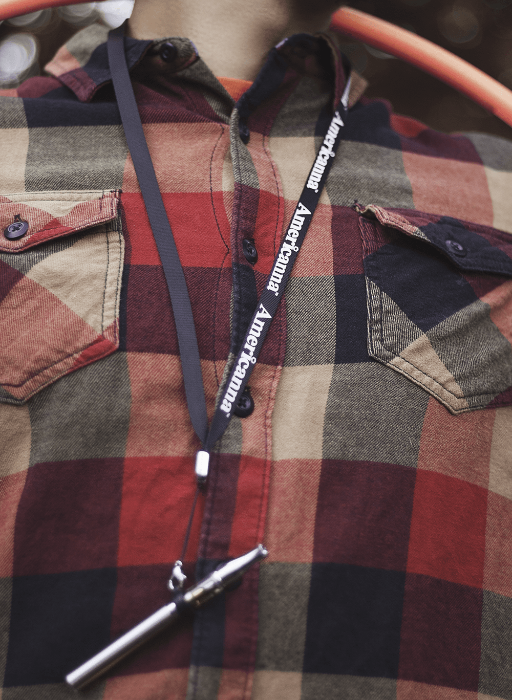 Americanna blog - Cannabis vape pen on lanyard flannel shirt